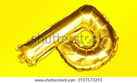 Golden letter P made of inflatable balloon isolated on Yellow background