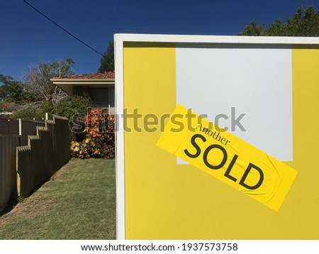 Large sold sign on home front yard. Real estate housing  property market concept. No people. Copy space