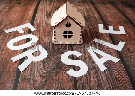 house model for sale with money, key on background, house for sale concept, closeup