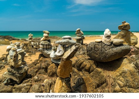 Balanced stones on the beach in Lak-Lam Ru National Park Thailand