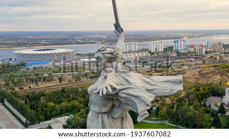 Volgograd, Russia. Evening view of the sculpture Motherland Calls! on the Mamaev Kurgan in Volgograd. Cloudy weather, Aerial View   Royalty-Free Stock Photo #1937607082