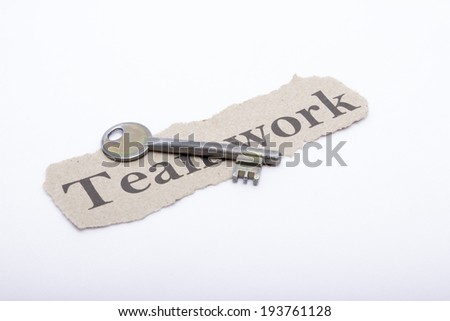 Key to teamwork on white background