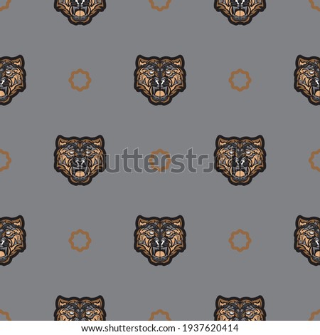 Seamless pattern with tiger face in colored Polynesian style. Good for clothing and textiles. Vector illustration.