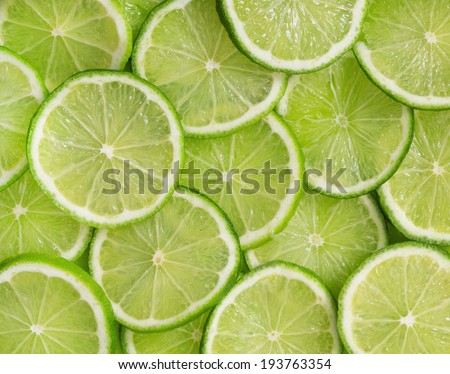 Green background with citrus-fruit of lime slices Royalty-Free Stock Photo #193763354