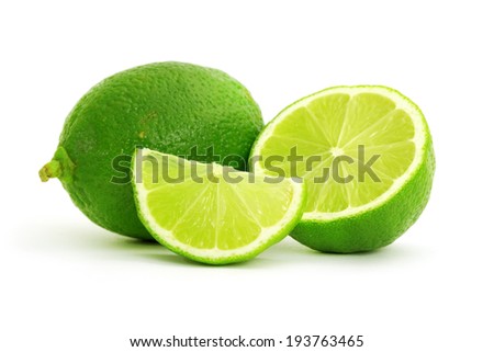 Limes with slices isolated on white background Royalty-Free Stock Photo #193763465