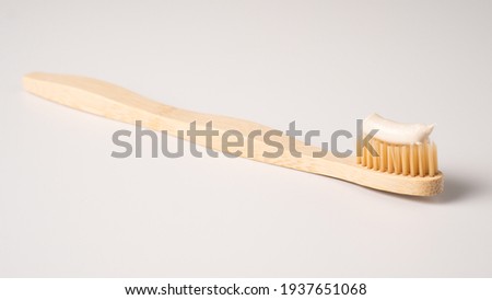 Bamboo toothbrush isolated on a white background. Eco dental concept. Zero waste Royalty-Free Stock Photo #1937651068