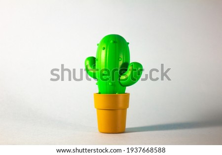 Toy Cactus in a pot with backdrop