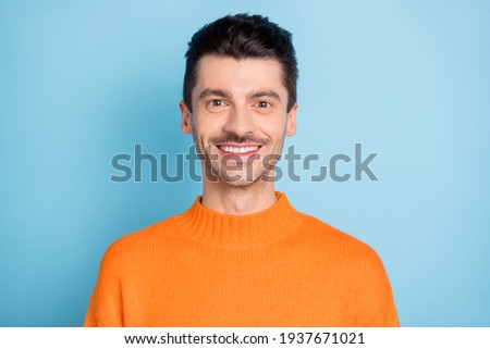 Portrait of bearded successful young man toothy smile look camera isolate don pastel blue color background