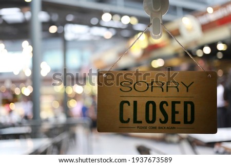 Shop closed of storefront sign,restaurant shows the closing status.