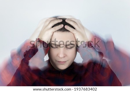 Man loses consciousness and falls down due to dizziness and disturbance of the vestibular apparatus. Severe headache and migraine. Concept of helping people suffering from migraines and dizziness Royalty-Free Stock Photo #1937683402