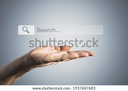 Searching browsing internet data information concept with man palm and search box and loupe above