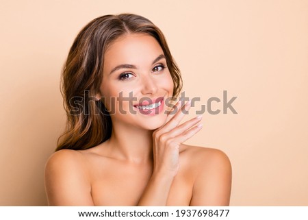 Photo of nice long hairdo optimistic lady without clothes hand face isolated on pastel beige color background Royalty-Free Stock Photo #1937698477