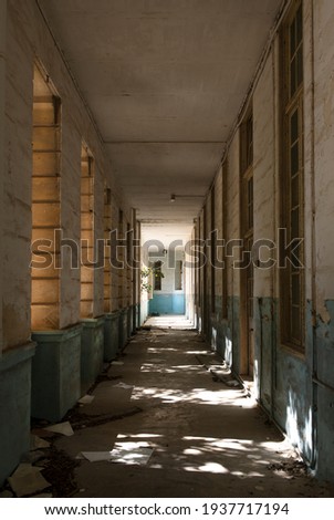 Long corridor in abandoned building.  Abandoned architecture.Abandoned building of old military hospital in Mtarfa (The Royal Navy Hospital Mtarfa),
