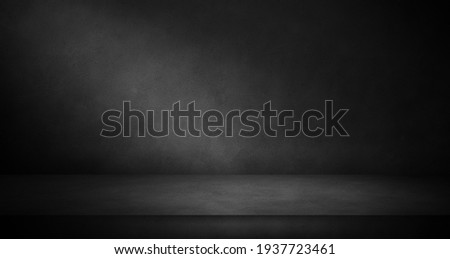 Concrete wall and floor texture in the dark with light, stone three dimensional room for mock up or product display background