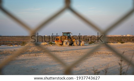 View through the fence over a construction site. selective focus