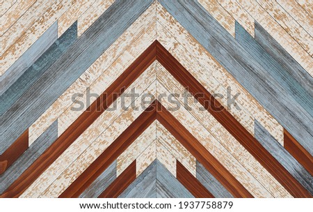 Vintage wooden wall with chevron pattern made of  painted narrow planks. Wood texture background. 