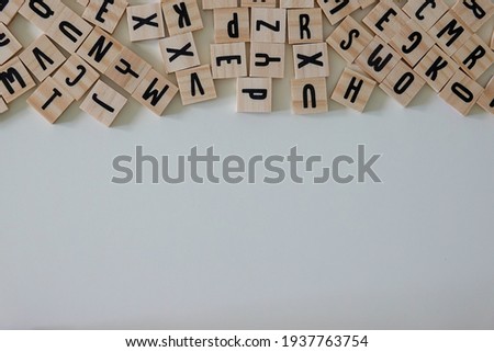 Wooden letters with an open space that can be used as copy space on a white back ground.