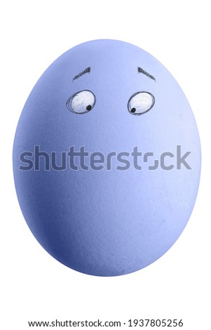 Large picture of an colored easter egg with drawn eyes on a white background.
