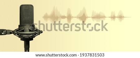 Recording studio microphone with sound waves on golden gradient background. Podcasting, broadcasting or music production  banner for website with copy space