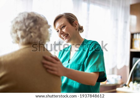 Health visitor talking to a senior woman during home visit
 Royalty-Free Stock Photo #1937848612