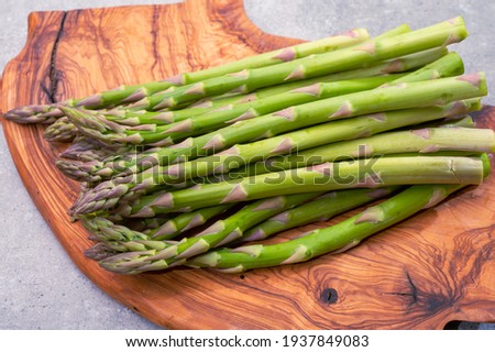 Bunch of fresh ripe green asparagus organic vegetables ready to cook or grill Royalty-Free Stock Photo #1937849083