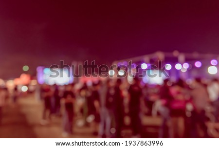 Vintage tone abstract blur image of Outdoor party in night time with light bokeh for background usage .
