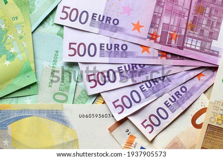Euro currency banknotes background. European paper money backdrop with 100, 200 and 500 euros bills. Royalty-Free Stock Photo #1937905573