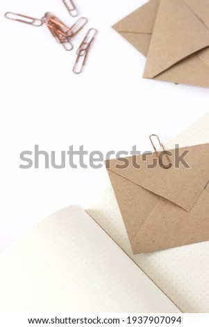 Kraft Paper Envelopes, Stationery on White Background. Minimalist Design Mockup Concept.