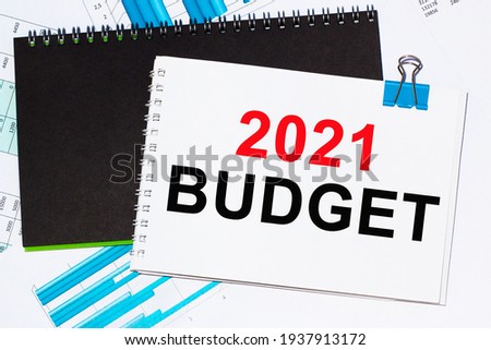 Business concept. List with text sheet BUDGET 2021 of paper for notes