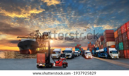 Container truck in ship port for business Logistics and transportation of Container Cargo ship and Cargo plane with working crane bridge in shipyard at sunrise, logistic import export concept Royalty-Free Stock Photo #1937925829