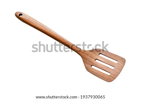 Wooden spatula on white background. Royalty-Free Stock Photo #1937930065