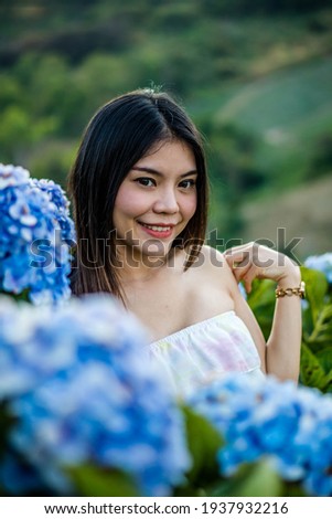 Asian woman in a hydrangea garden Women and flowers