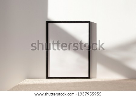 Minimalist black frame mockup on white background with shadow