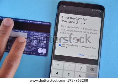 Mandi, Himachal Pradesh, India - March 05 2021: Concept of online shopping, Enter the cvv number at e-commerce website in smartphone for shopping.  Royalty-Free Stock Photo #1937968288
