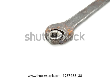 Rusty wrench on white background close-up. Tool, old, rare, vintage, macro, DIY