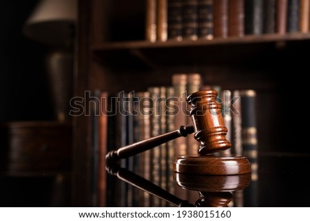 Law concept. Justice symbol on book background.