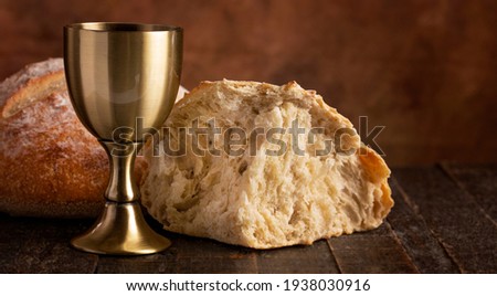 The Sacrament of Holy Communion  on a Dark Wooden Table Royalty-Free Stock Photo #1938030916