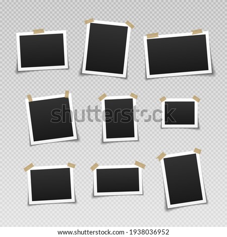Photo frames with adhesive tape. Vintage empty photos frame with adhesive tapes. Royalty-Free Stock Photo #1938036952