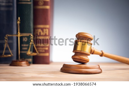 law concept, scales with judge gavel and law book

