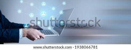 business man holding computer with social network icon