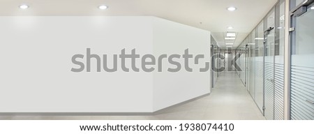 Empty office hall with glass walls and doors Royalty-Free Stock Photo #1938074410