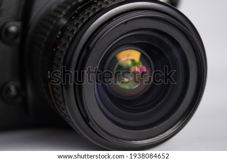 close up of camera photo lens on white background