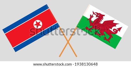 Crossed flags of North Korea and Wales. Official colors. Correct proportion