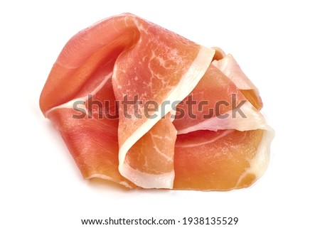 Italian prosciutto crudo or spanish jamon. Jerked meat, isolated on white background. High resolution image. Royalty-Free Stock Photo #1938135529