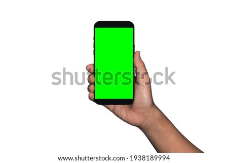 Businessman hand holding black smartphone isolated on white background, green screen background - Clipping Path.