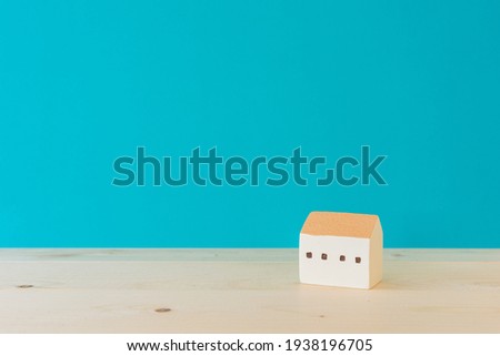 A toy house on the wooden floor