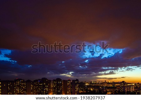 Sunset sky over the illuminated city. Panorama of Kiev, Ukraine