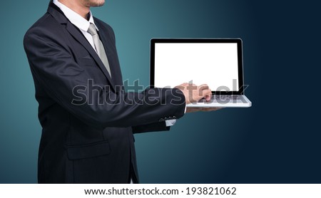 Businessman standing posture hand hold notebook laptop isolated on dark background