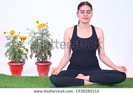 Young Yoga teacher doing asanas and meditation postures
