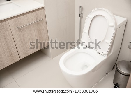Clean Toilet bowl in hotel bathroom interior decoration Royalty-Free Stock Photo #1938301906